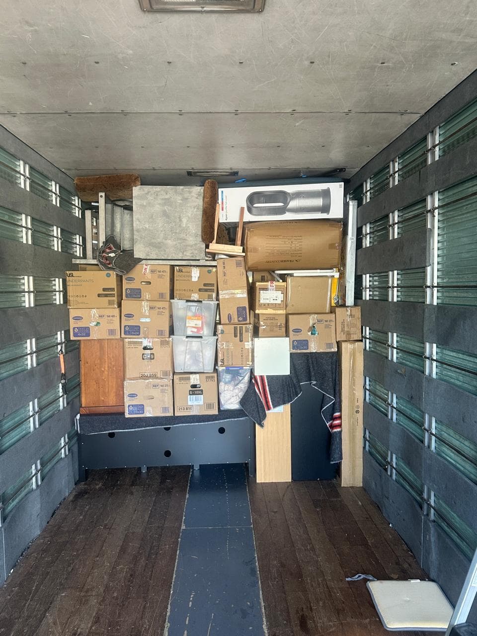 Boxes and furniture carefully packed inside our moving truck