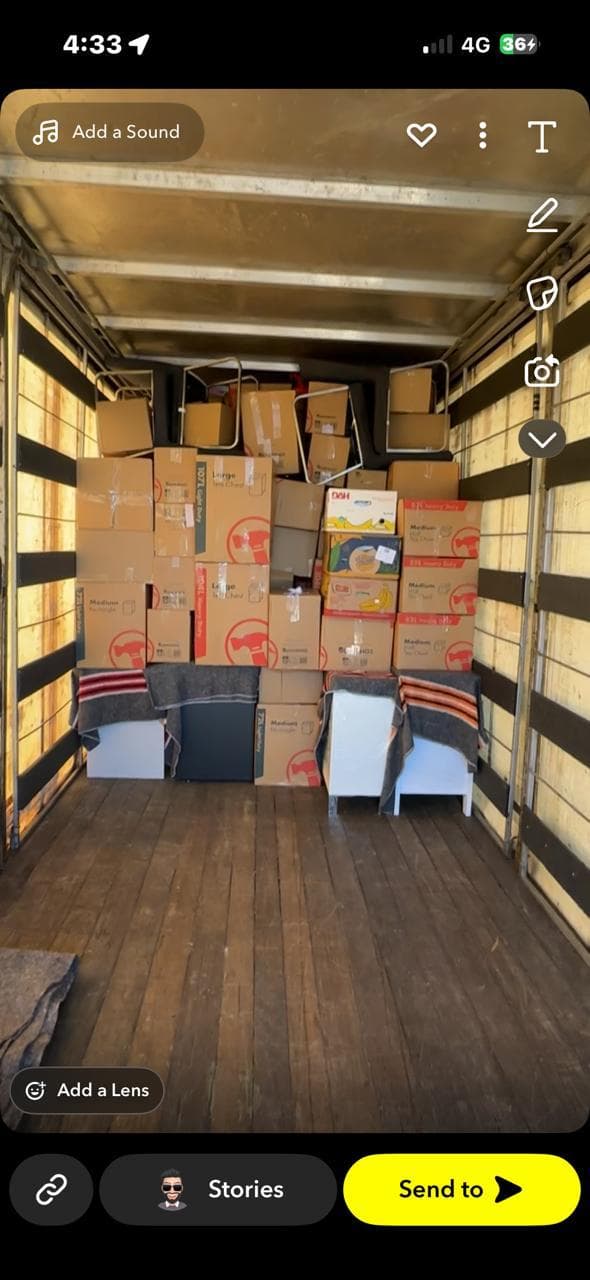 A truck loaded with boxes and protected household items
